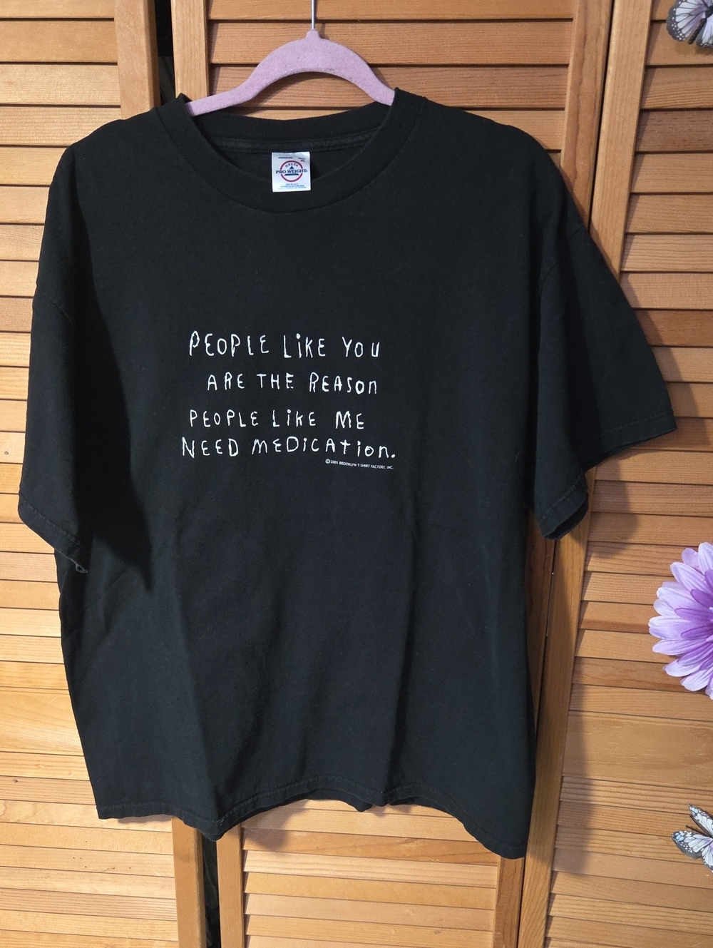 Black Short-Sleeve Graphic Tee with White Text 'People Like You...'